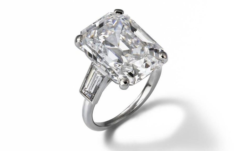 Platinum engagement ring with 10.5-carat emerald-cut diamond flanked by two baguette-cut diamonds